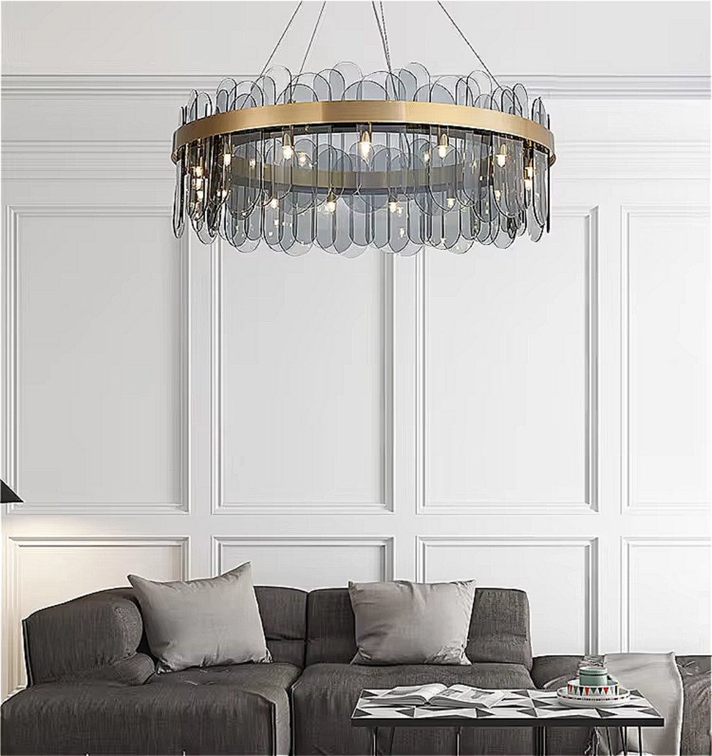 GLASSOLA chandelier hanging in a modern living room, adding sculptural elegance with grey glass and ambient lighting.