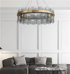 GLASSOLA chandelier hanging in a modern living room, adding sculptural elegance with grey glass and ambient lighting.