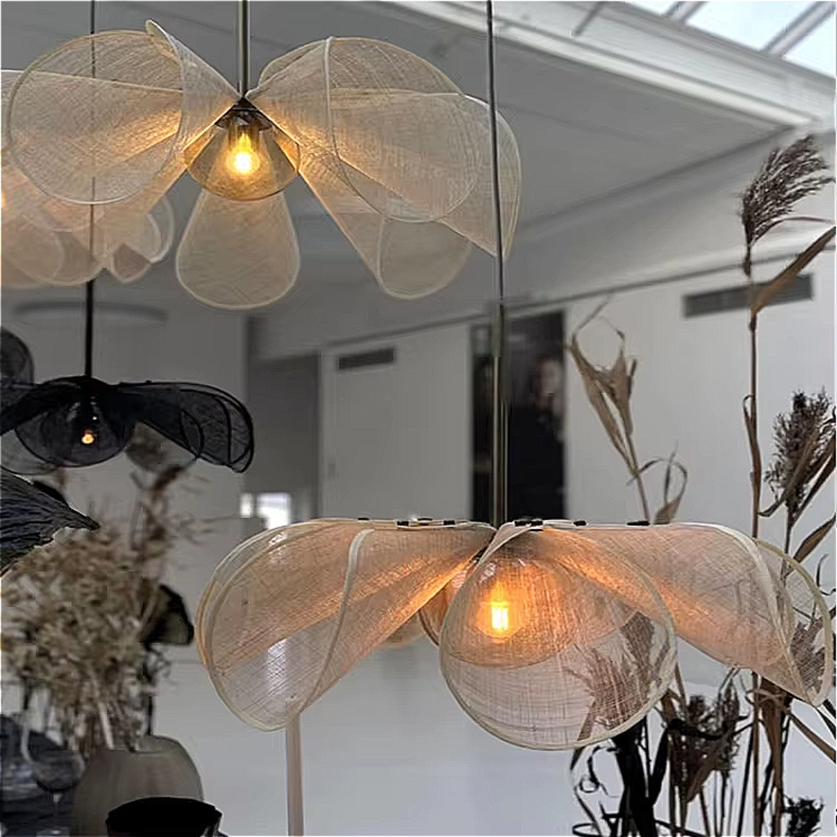 Twin PETALIQ chandeliers installed in modern ceiling – minimalist lotus lighting in balanced symmetry | LINKORI PETALIQ Embrace