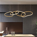 4-ring gold LED chandelier hanging above modern luxury kitchen island — sculptural statement lighting for contemporary interiors | LINKORI JULIPPER S kitchen view