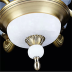 Detailed close-up of the base and lower finial on LINKORI VROLLADO antique gold chandelier