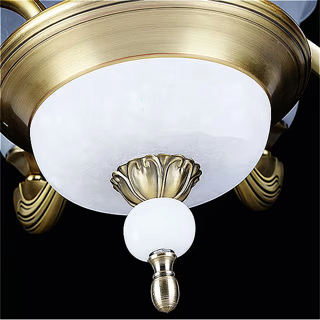 Detailed close-up of the base and lower finial on LINKORI VROLLADO antique gold chandelier