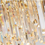 Premium Art Deco crystal pendant light fixture in master bedroom suite with geometric gold framework perfect for luxury bedroom and walk-in closet lighting