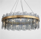 Full view of LINKORI GLASSOLA chandelier featuring layered grey glass leaves and brushed gold round frame design.