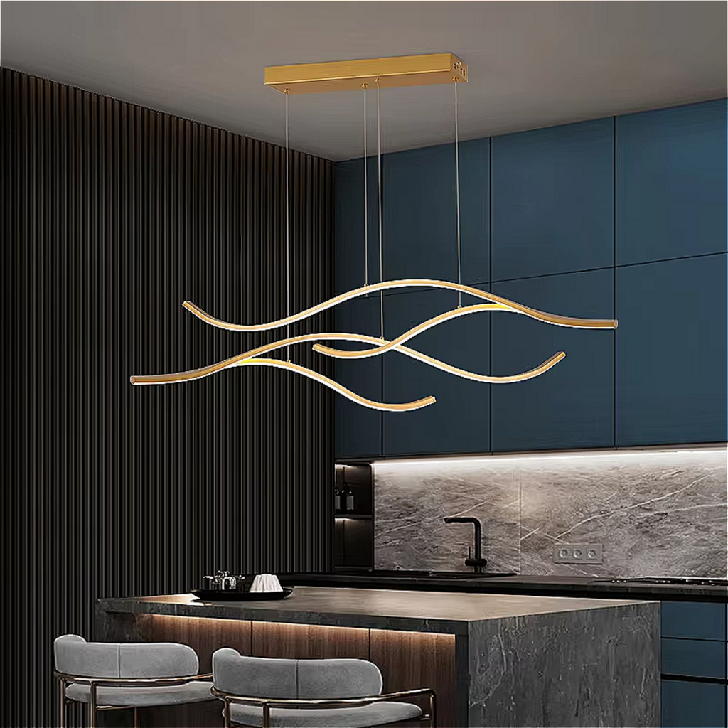 Gold sculptural wave chandelier suspended over a modern luxury kitchen island with sleek marble and wood accents – LINKORI CHULLENG S.