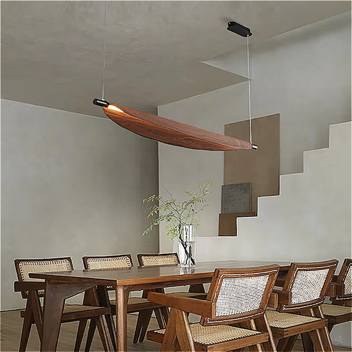 Organic walnut chandelier illuminating a wooden dining table in a Japandi-style living room