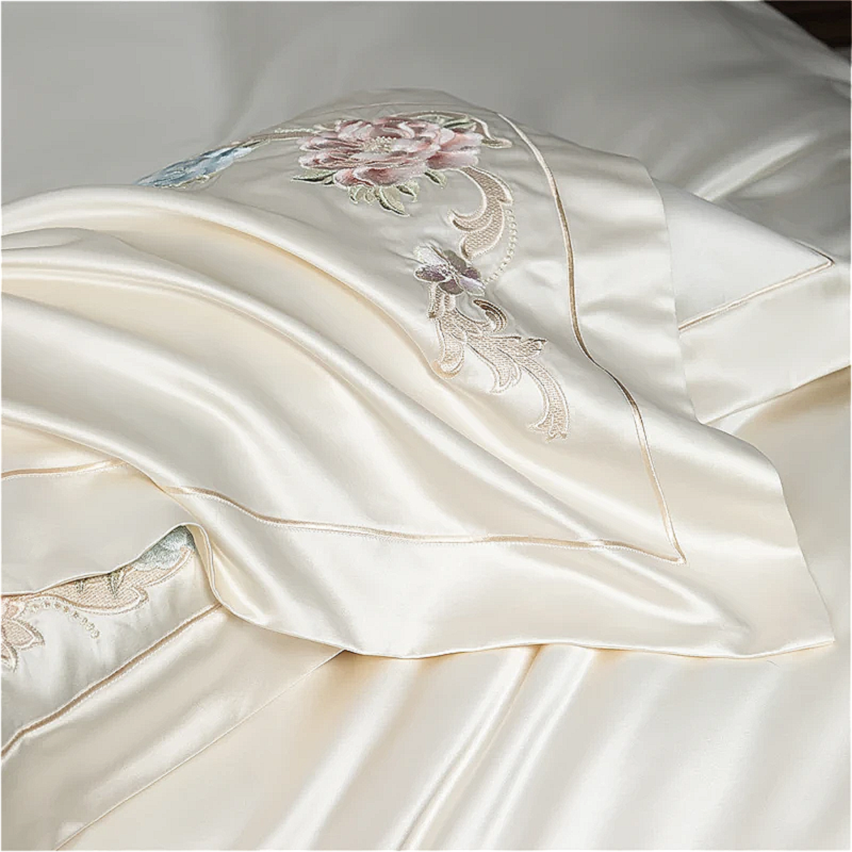 Luxury hotel-style bedding set with embroidered botanical florals on silky Egyptian cotton fabric