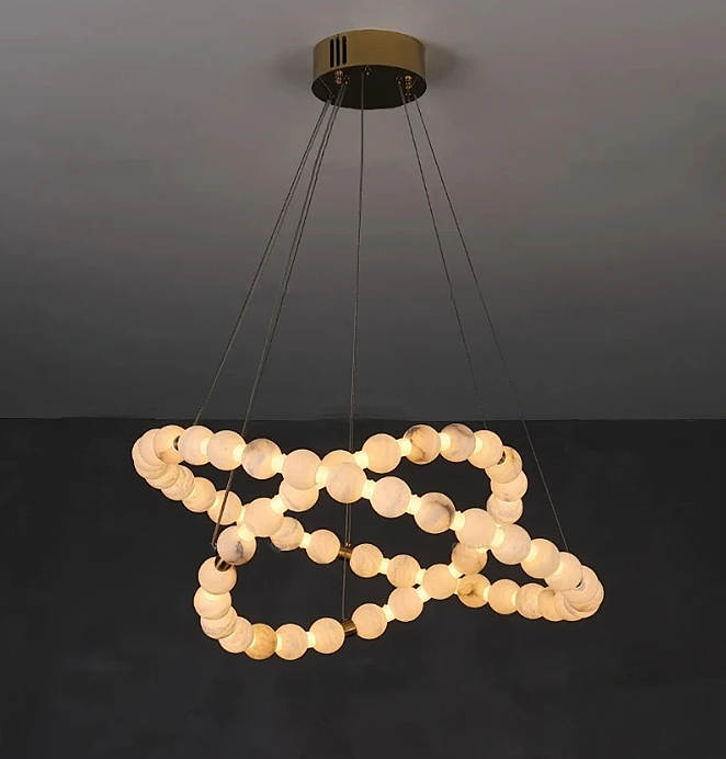 Sculptural alabaster ring chandelier with floating double-ring design and soft atmospheric lighting – Spatial Direction Curated by LINKORI