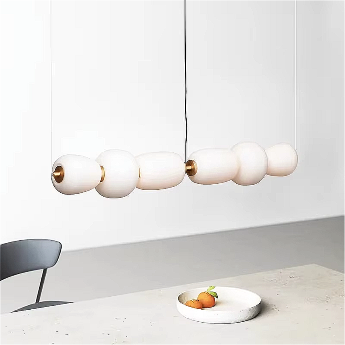 modern linear chandelier with opal glass globes, soft diffused glow, perfect kitchen island and bar pendant