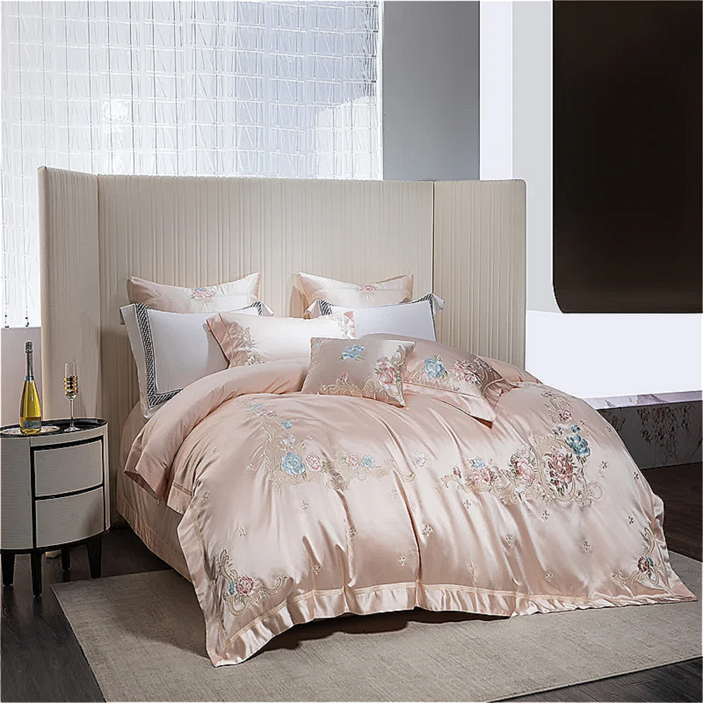 Premium blush pink satin duvet cover featuring artistic floral embroidery design for sophisticated decor