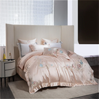 Premium blush pink satin duvet cover featuring artistic floral embroidery design for sophisticated decor
