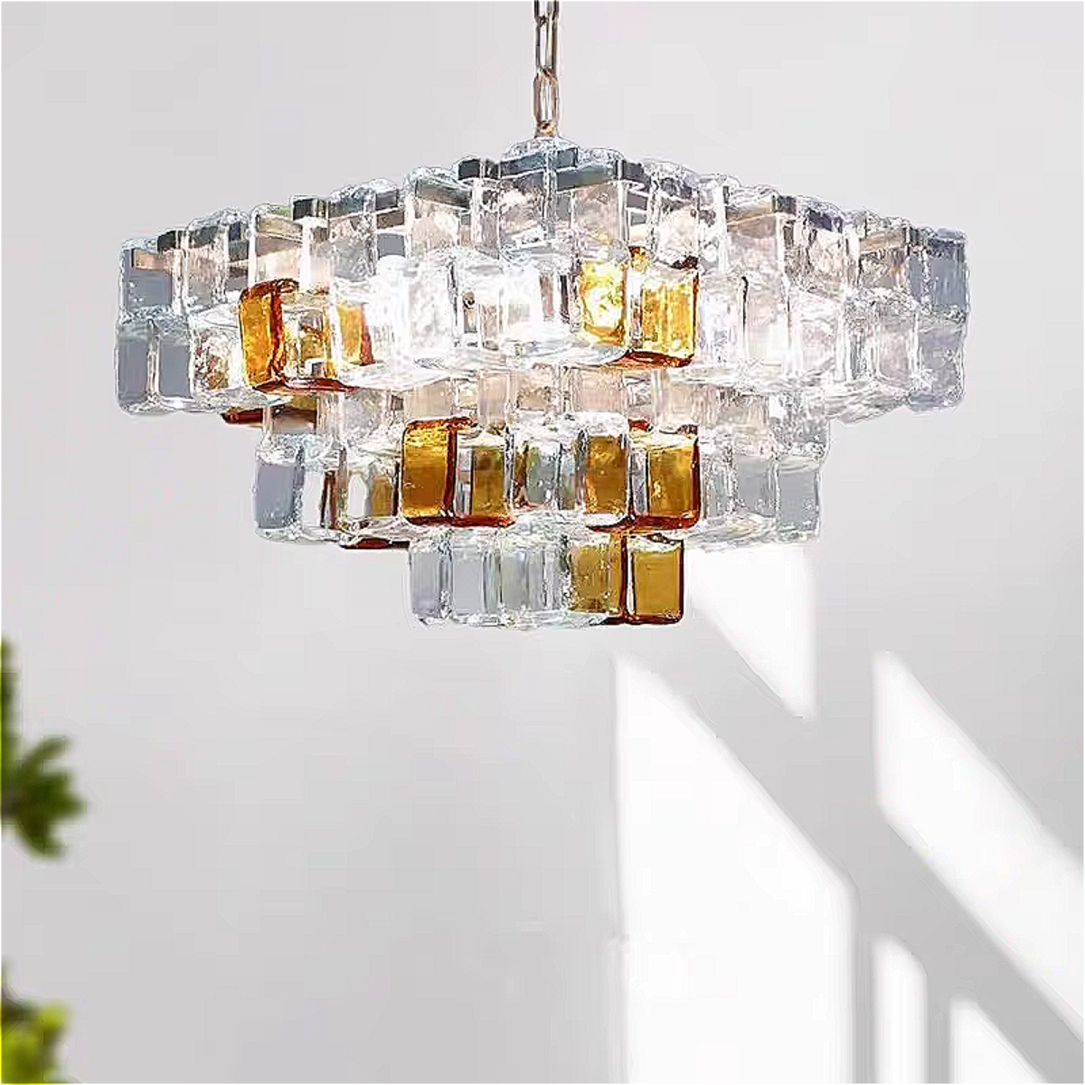 Dining room glass cube chandelier — amber & clear geometric statement pendant centered over table, dimmable 3500K warm ambience for modern interiors | LINKORI CUBLIQUE dining view