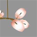 Close-up of pink Murano-style glass petals with brushed brass accents on LINKORI TULLIA pendant light.