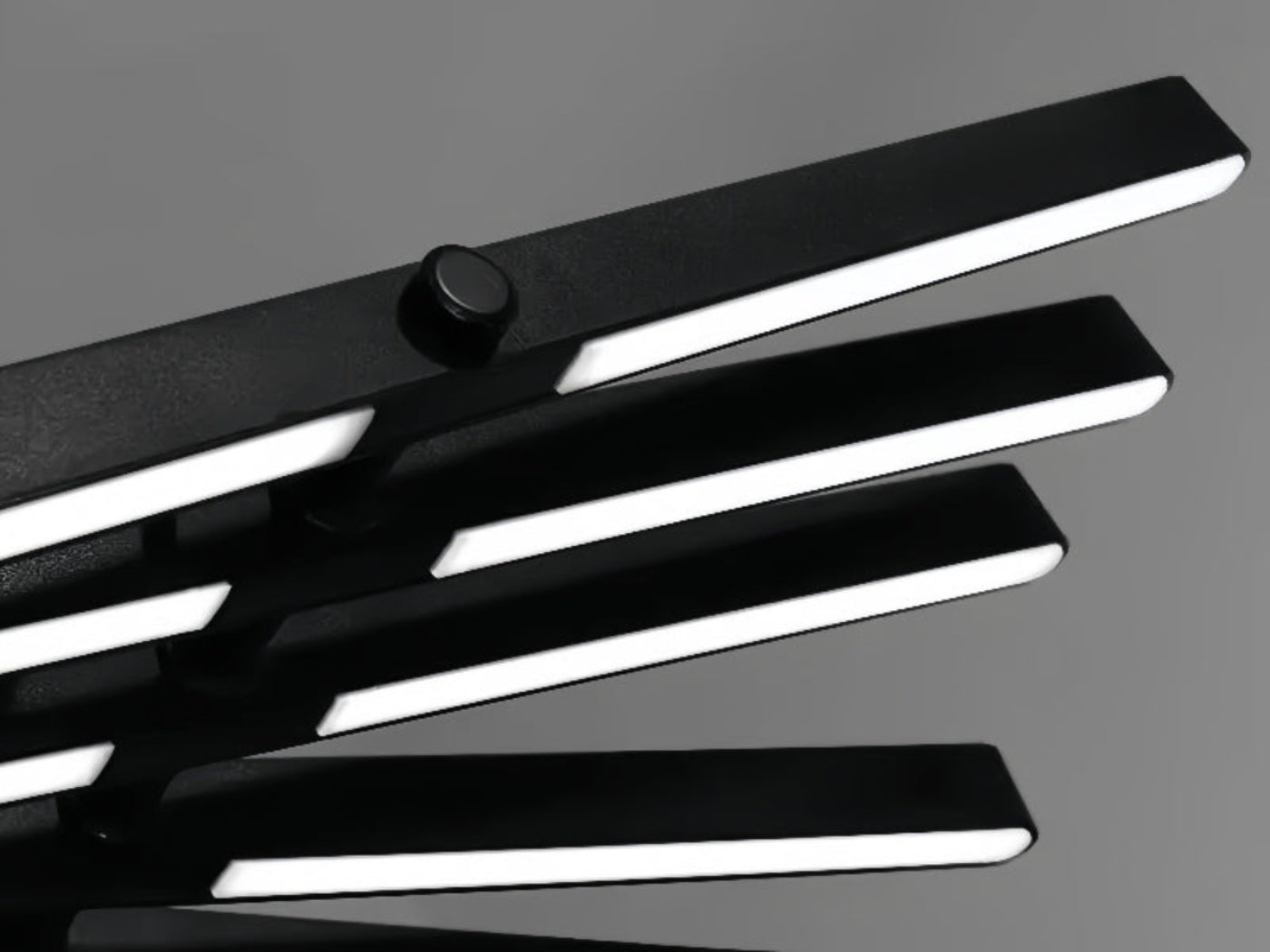 Detail of Warm White Glow Emitting from Adjustable LED Sticks – LINKORI Black Stick Lighting Design