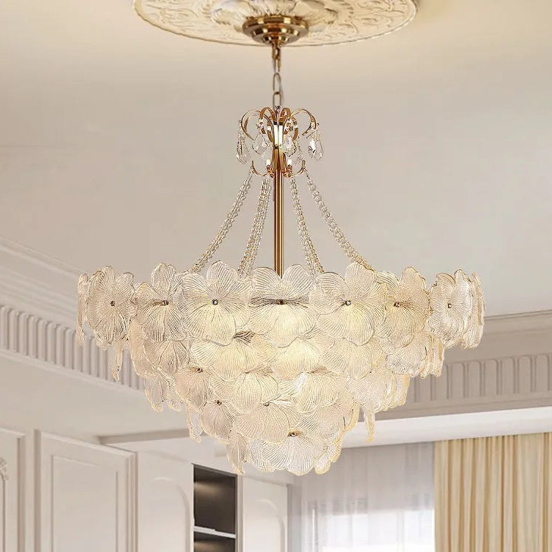 LINKORI SHALOLLYE floral chandelier hanging in a modern luxury living room with neutral tones and gold accents.