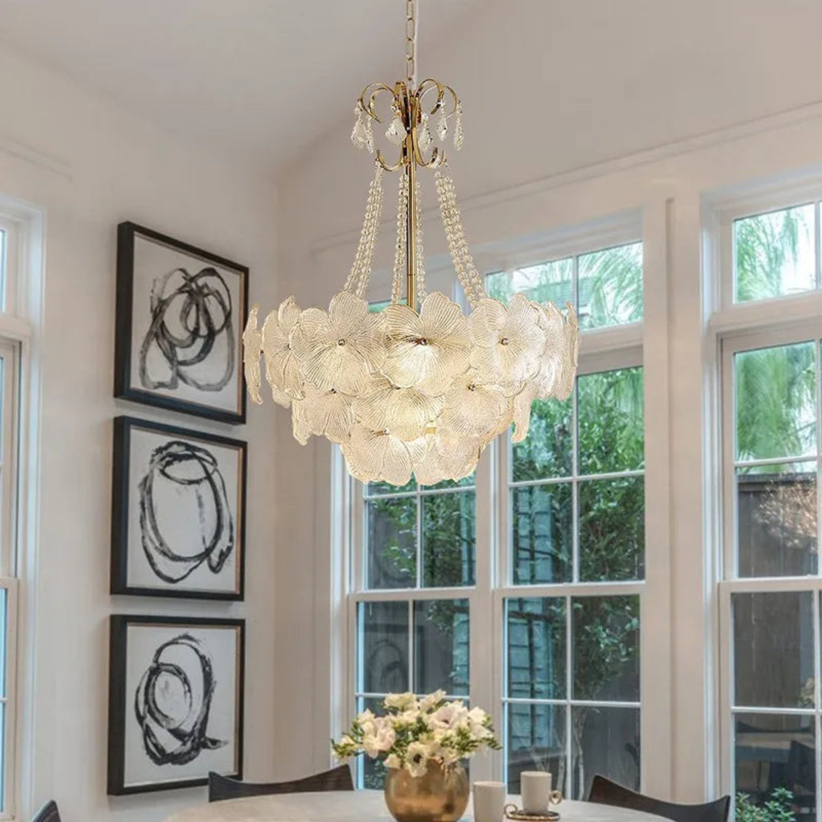 LINKORI SHALOLLYE floral chandelier over a luxe open kitchen and dining island, creating a statement with layered elegance.