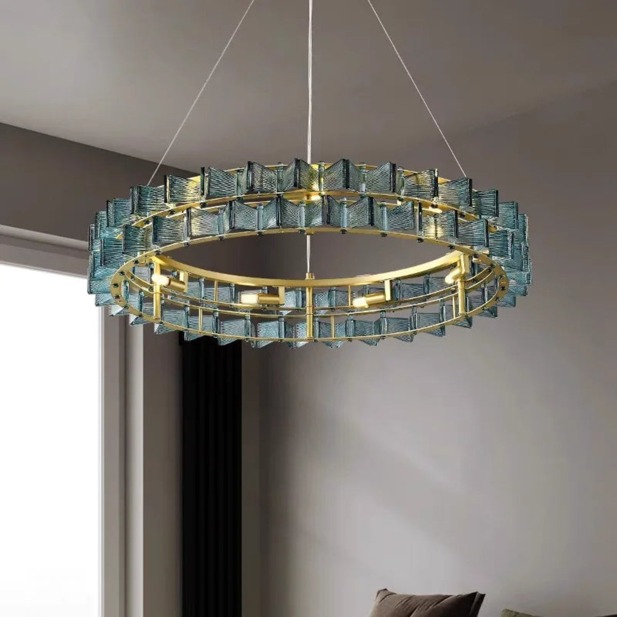 Interior shot of PRUTIKE chandelier illuminating a refined living space with sculptural lighting and ambient glow