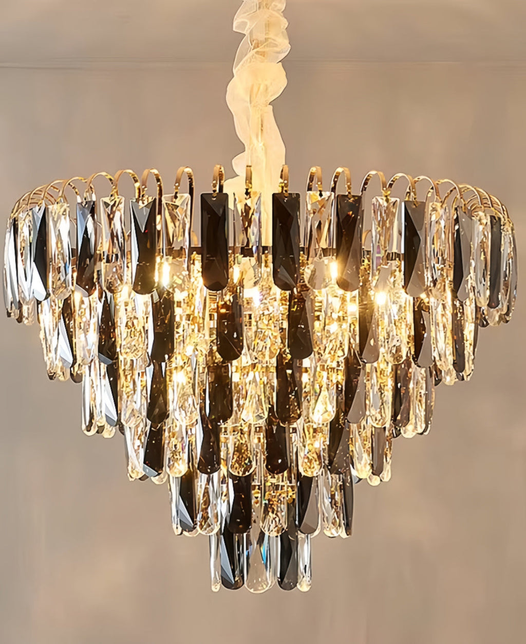 Premium teardrop crystal chandelier in luxury living room entryway showing 21.6-inch diameter size and brilliant light refraction effects