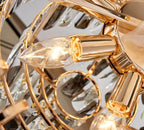 Close-up detail of precision-cut teardrop crystals on luxury chandelier showing museum-quality crystal craftsmanship and gold finish hardware