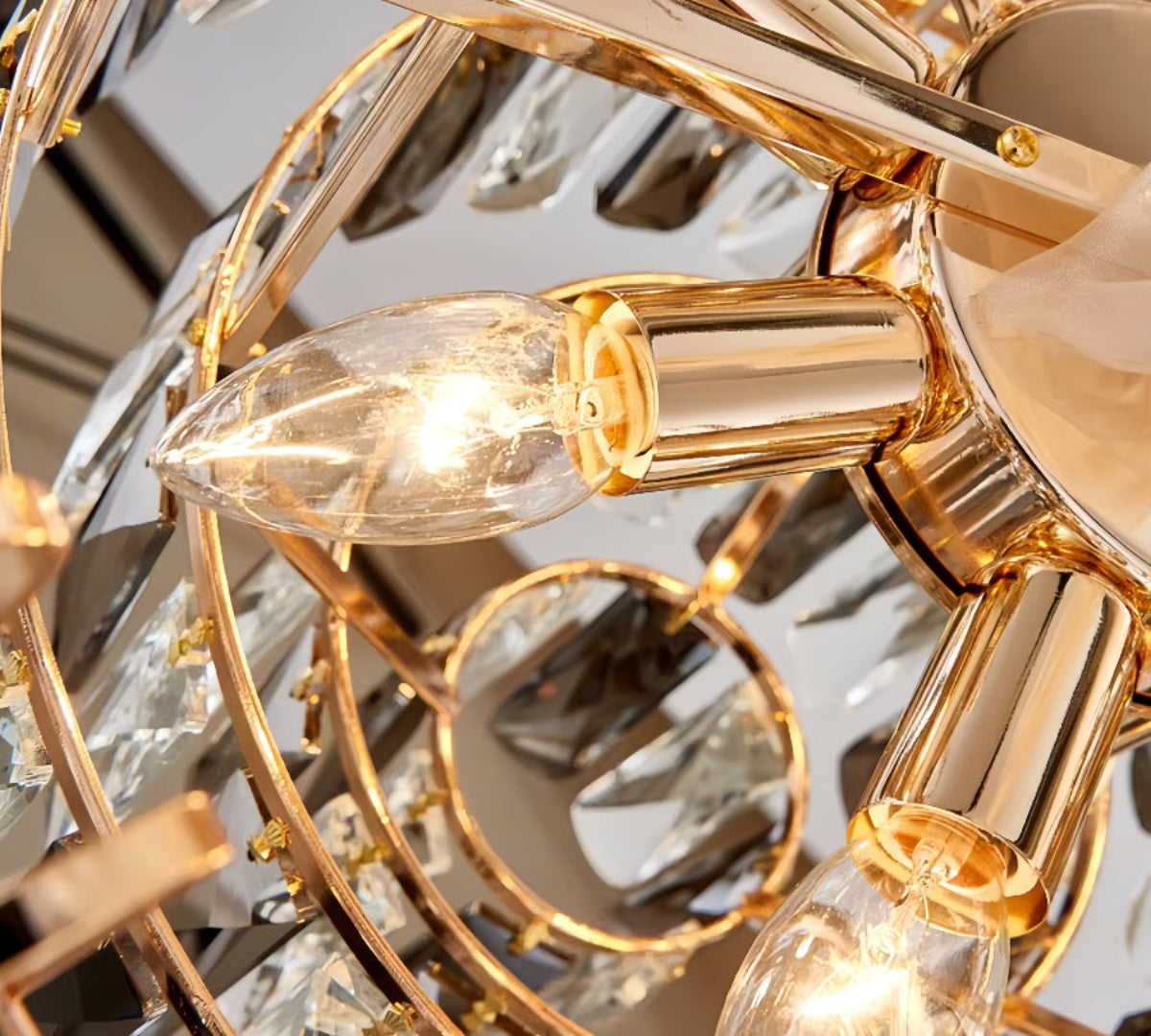 Close-up detail of precision-cut teardrop crystals on luxury chandelier showing museum-quality crystal craftsmanship and gold finish hardware