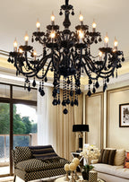 JANJULIQ black chandelier styled in vintage setting – castlecore meets contemporary moody luxury.