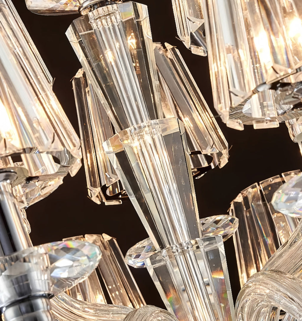 Macro view of crystal droplet from LINKORI LUXULUXE chandelier – faceted glass reflecting soft light

