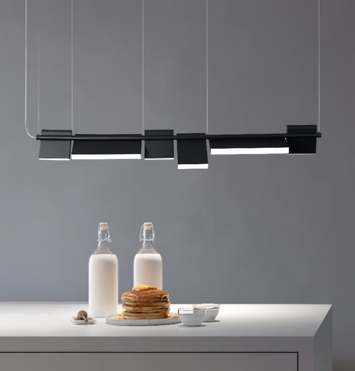 Modern kitchen island lighting above dining table – sculptural modular 6-panel black LED chandelier | LINKORI MODULQ BLACK LINE.