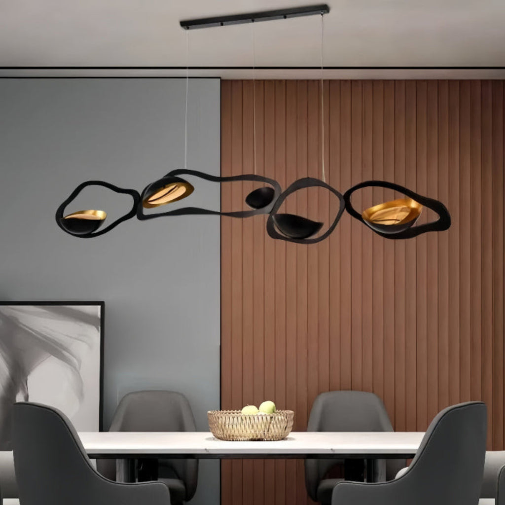 Sculptural Black and Gold LED Chandelier in Contemporary Dining Room — bold wave-shaped pendant light in modern neutral interior