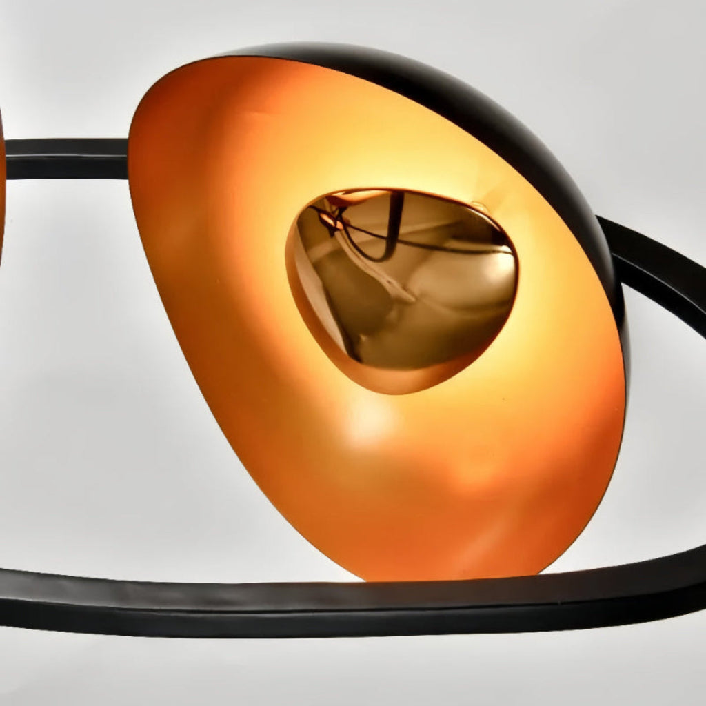 Artistic Black and Gold Ripple Pendant Light – Sculptural Chandelier Close-Up — dynamic LED fixture highlighting curve and finish detail

