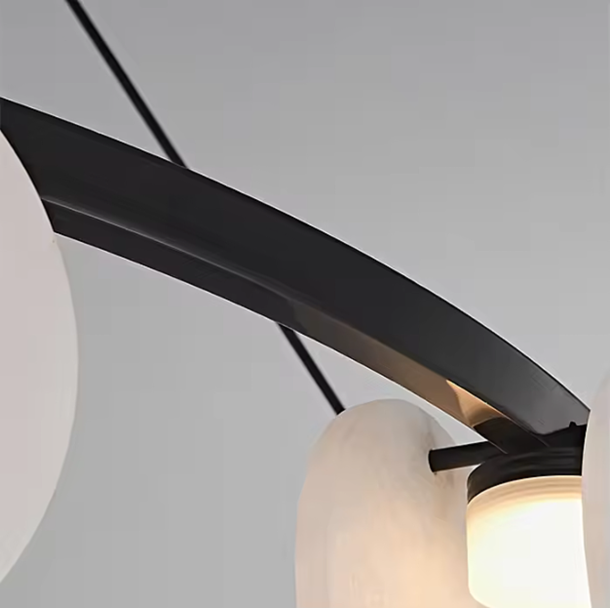 alabaster disc chandelier close up showing natural veining and warm LED lighting