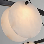 natural alabaster chandelier close up detail with organic stone texture and soft glow