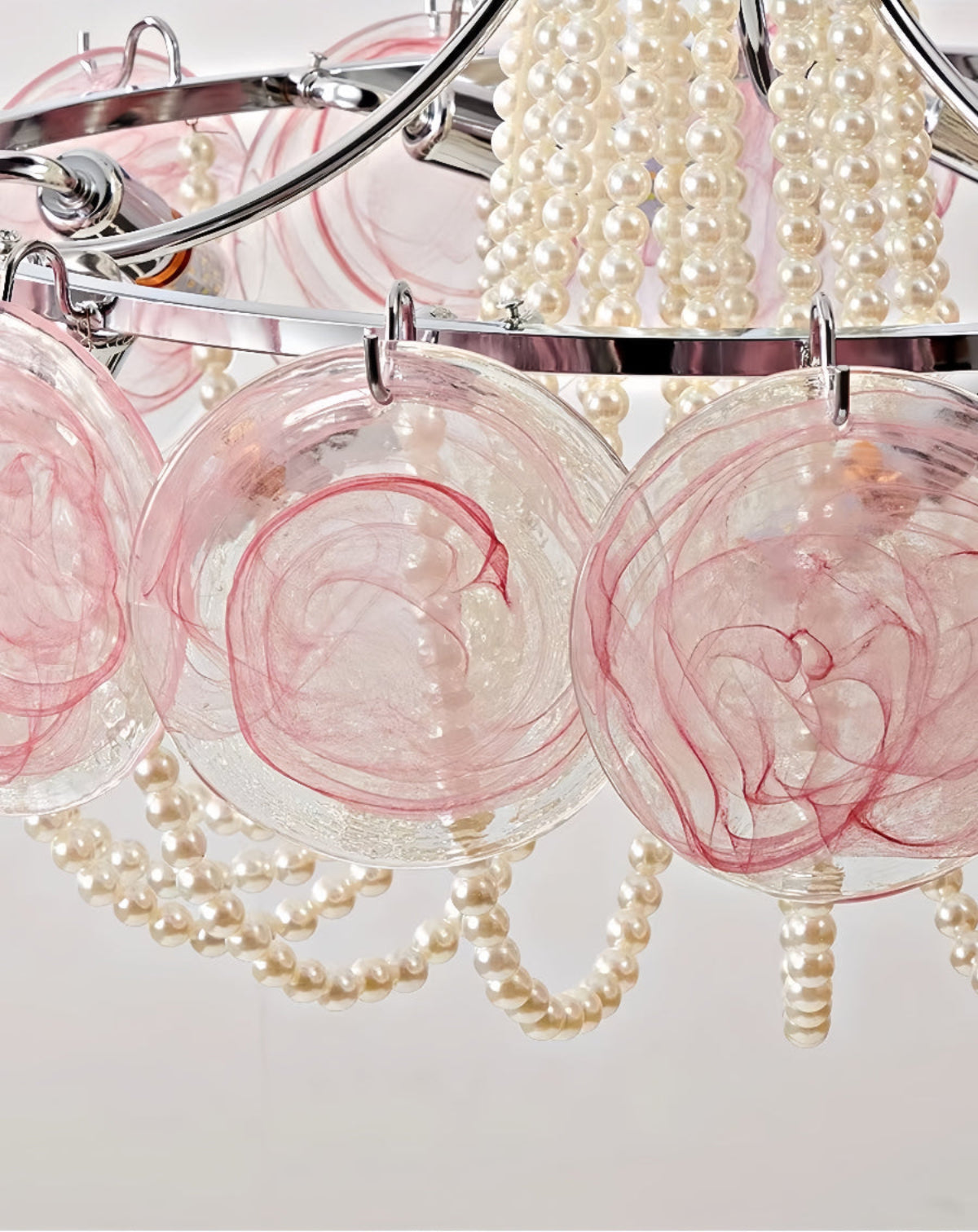 Close-up of pink Murano-style glass discs and pearl beaded strands — artistic Art Deco chandelier detail, chrome hardware, high-sparkle texture | LINKORI PALACE detail