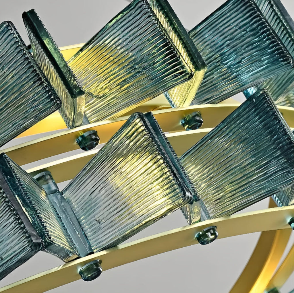 Close-up of faceted glass panels and brushed gold metal frame on PRUTIKE chandelier – detailed craftsmanship and luxe finish