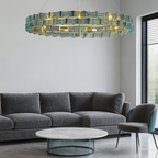 Minimalist modern living room with PRUTIKE chandelier as a bold focal point – structured glass and metallic detailing