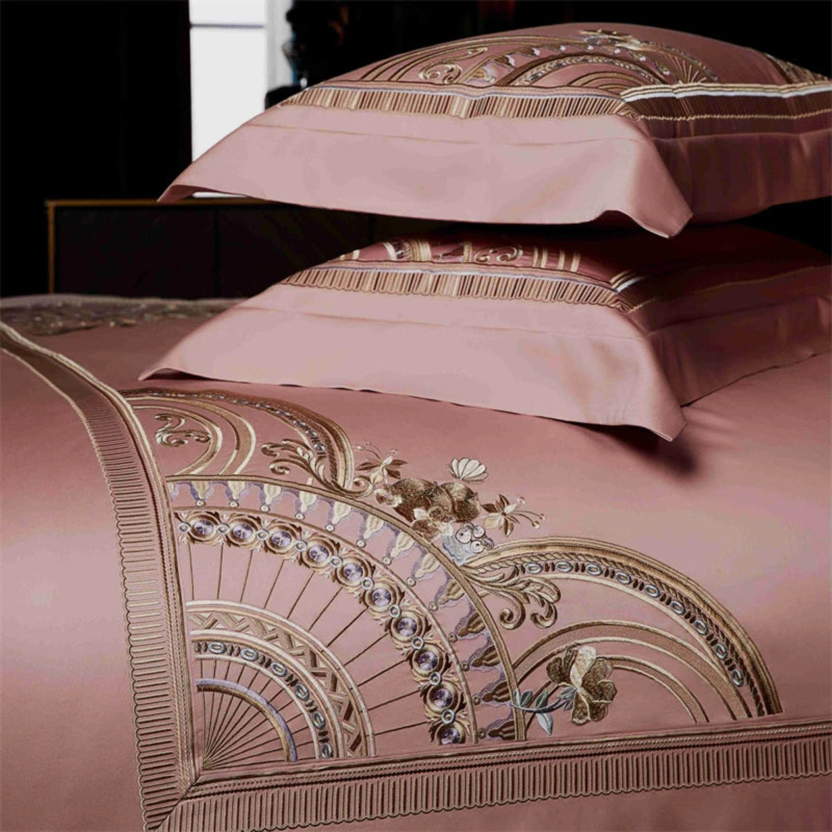 Designer blush pink satin cotton bedding with intricate geometric embroidery for romantic bedroom decor