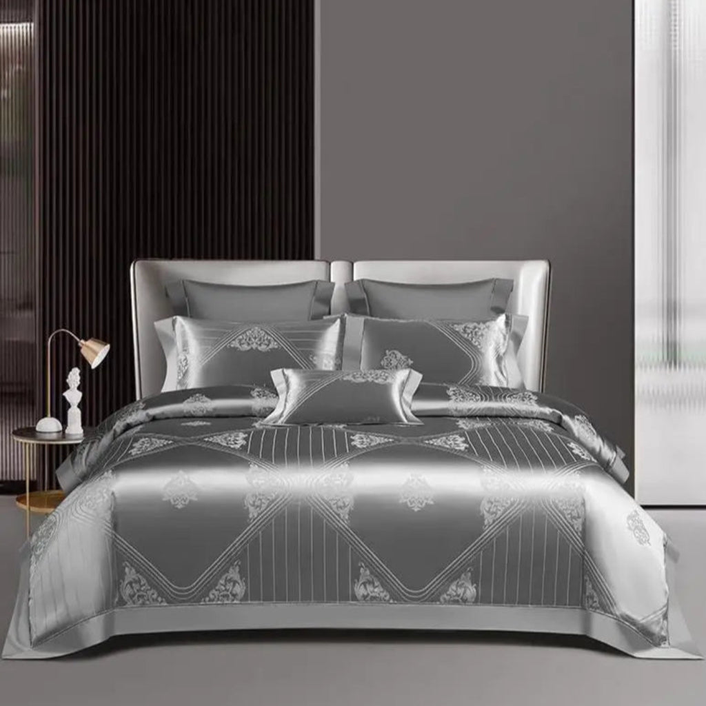 Premium cotton satin duvet cover displaying elegant silver geometric jacquard motifs with coordinating trim