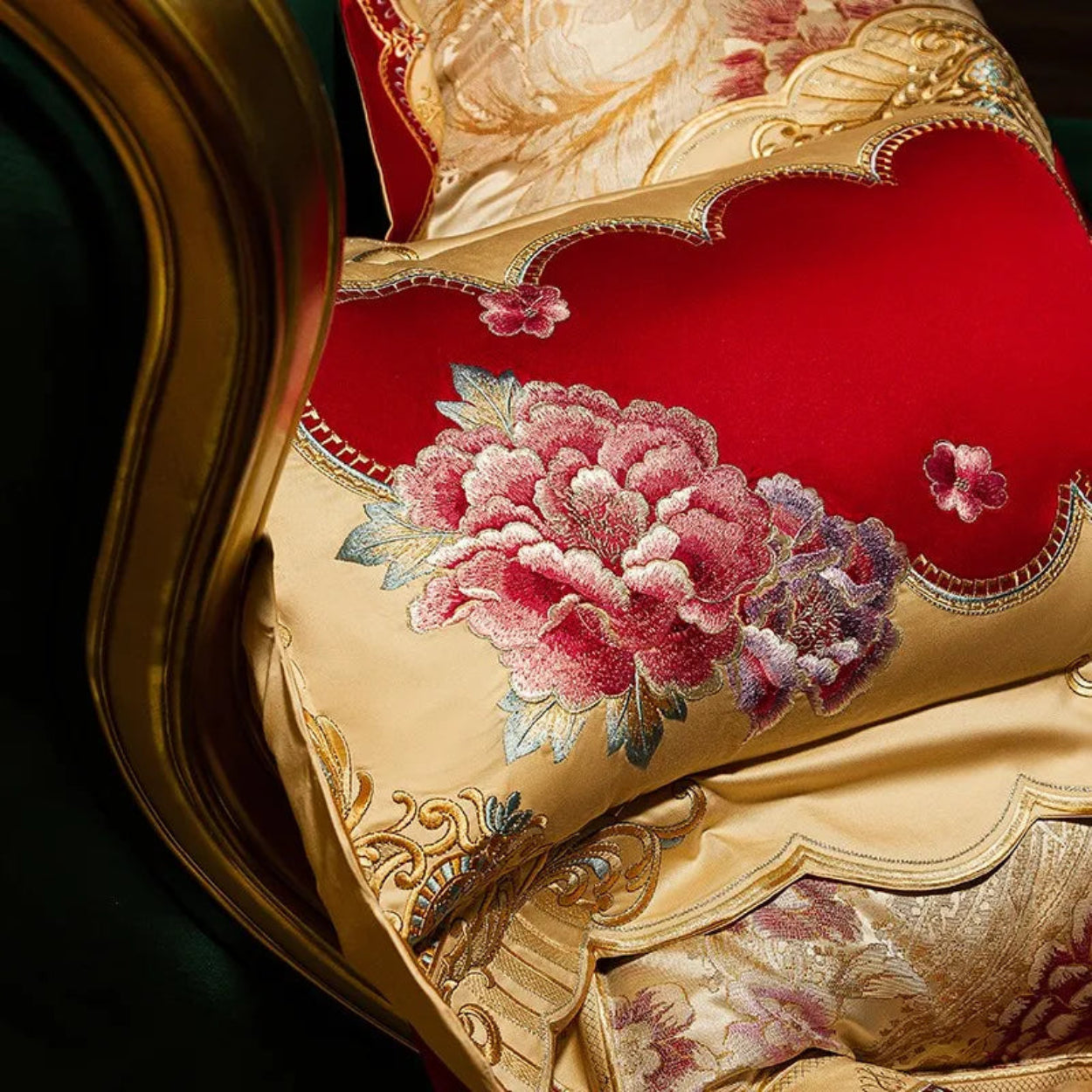 Luxury Egyptian cotton ivory bedding with red floral embroidery patterns for designer interiors