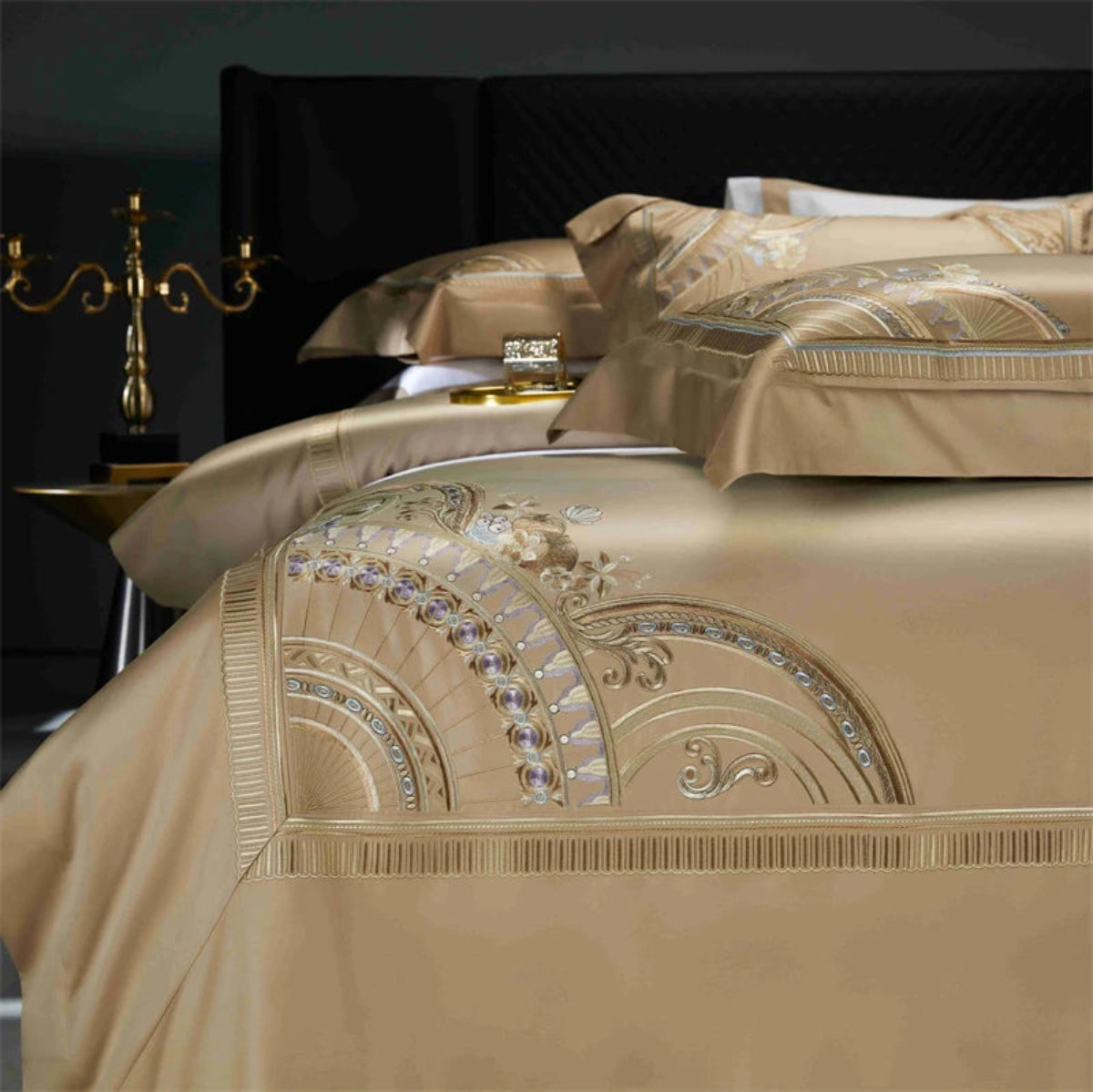Designer gold satin cotton bedding with intricate geometric embroidery pattern for elegant master bedroom decor
