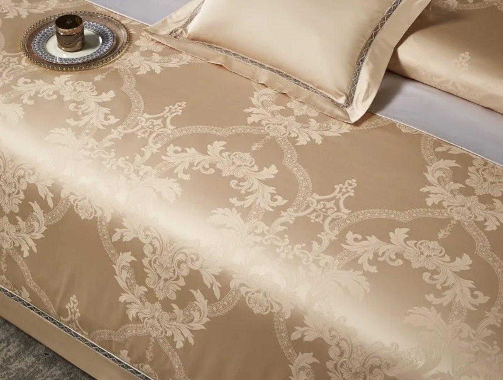 High-quality 1200TC cotton satin bedding with intricate golden damask patterns and couture trim borders
