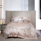 Luxury hotel-style pink bedding with delicate embroidered florals on silky soft cotton fabric