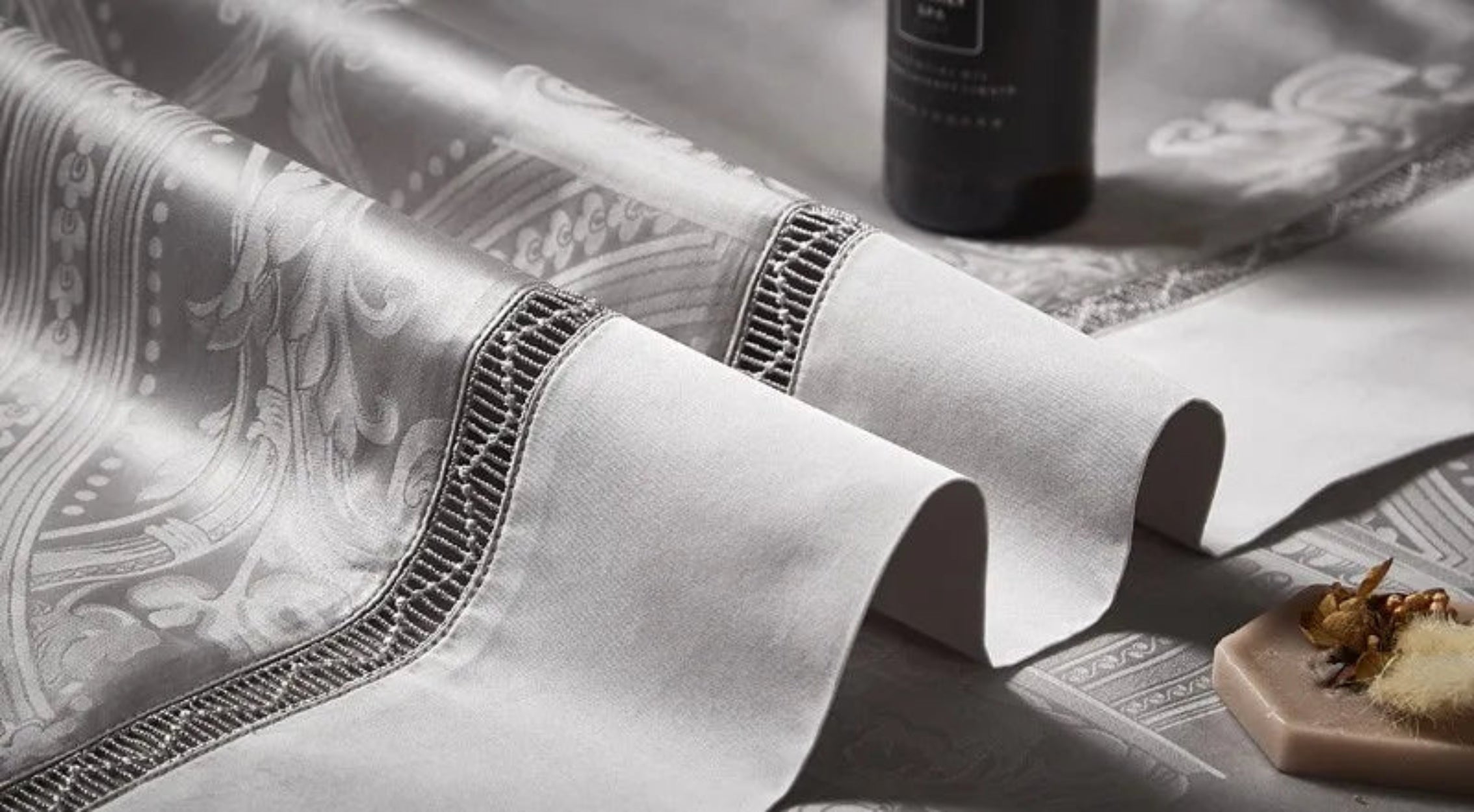 Ultra-luxury cotton satin duvet cover displaying elegant platinum silver grey damask jacquard motifs with designer trim