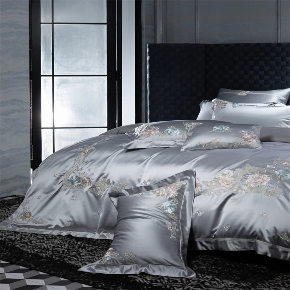Luxury hotel-style grey bedding with delicate embroidered botanical florals on soft cotton fabric