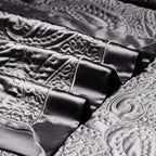Dark grey satin jacquard duvet cover set with elegant paisley embossed pattern – quiet luxury bedding style