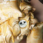 Gold marbled satin fabric close-up showing jacquard texture and sheen, LINKORI The Royal Gold