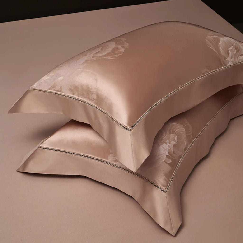 Luxury rose gold bedding set showcasing botanical floral motifs in lustrous Egyptian cotton satin fabric