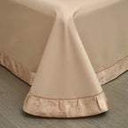 Premium cotton satin duvet cover displaying elegant blush gold damask jacquard motifs with coordinating trim - elegant bedroom