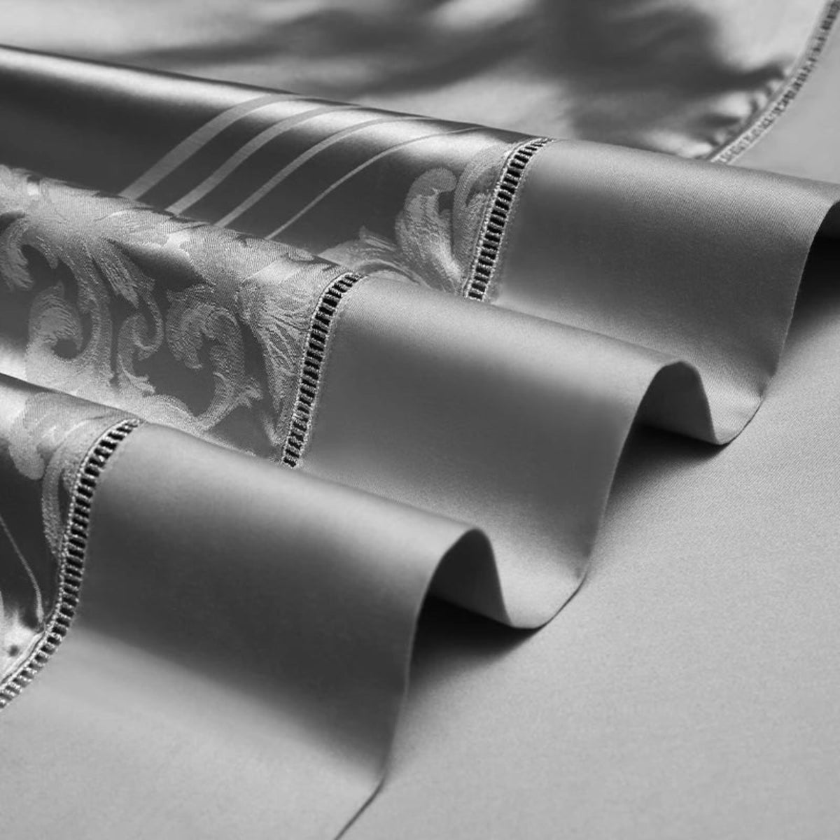 Sophisticated silver geometric duvet cover set featuring premium Egyptian cotton satin with architectural motifs