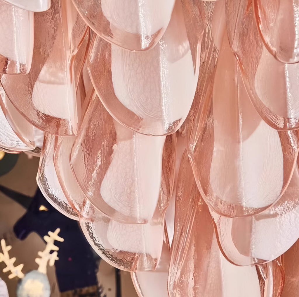 Modern sculptural glass chandelier with vintage-inspired pink Murano discs — perfect for contemporary dining spaces and luxury foyers.