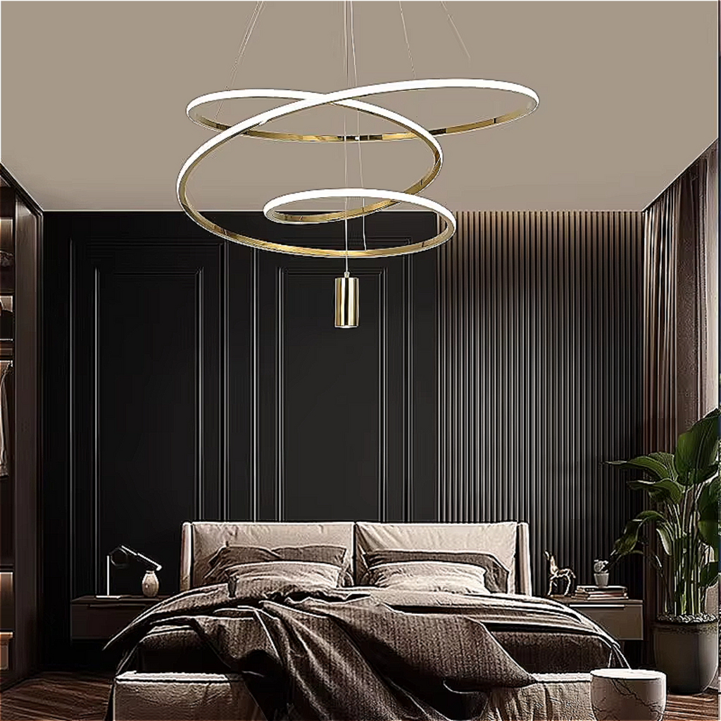 Modern luxury bedroom lit by gold 3-ring LED chandelier — dimmable triple ring pendant above bed, adjustable height, soft warm white | LINKORI BLANGCHI
