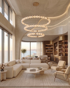 LINKORI AURELIA large alabaster orb ring chandelier in bright coastal penthouse 
living room — ocean view, organic modern interior, natural stone luxury chandelier